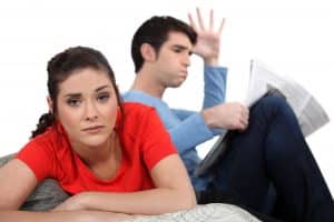 Couple having argument on sofa