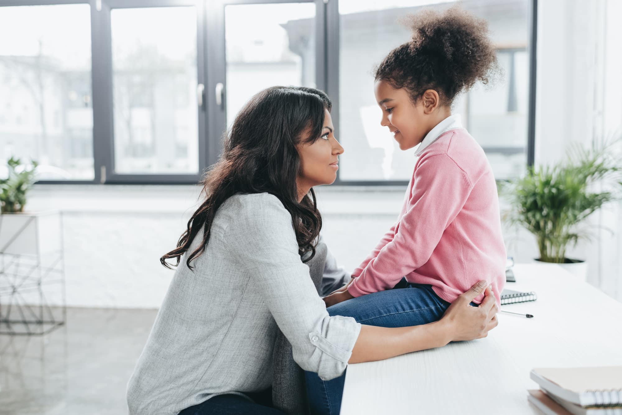 Mother talking to her daughter