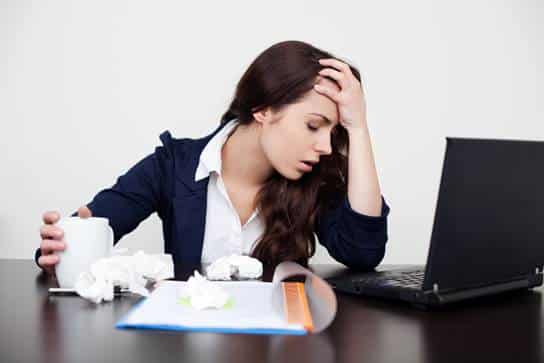 Stressed woman sitting at desk