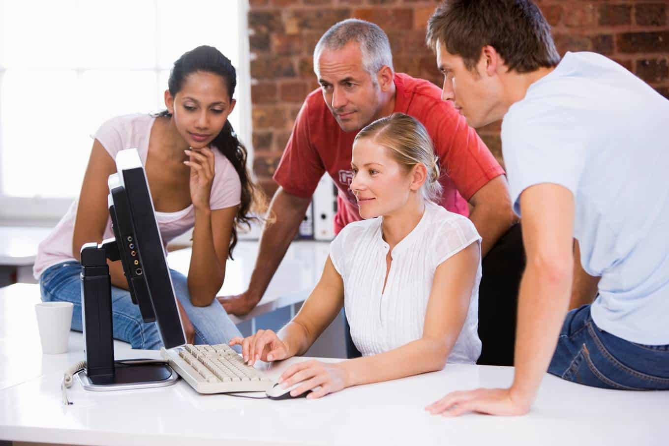 Family gathers around computer